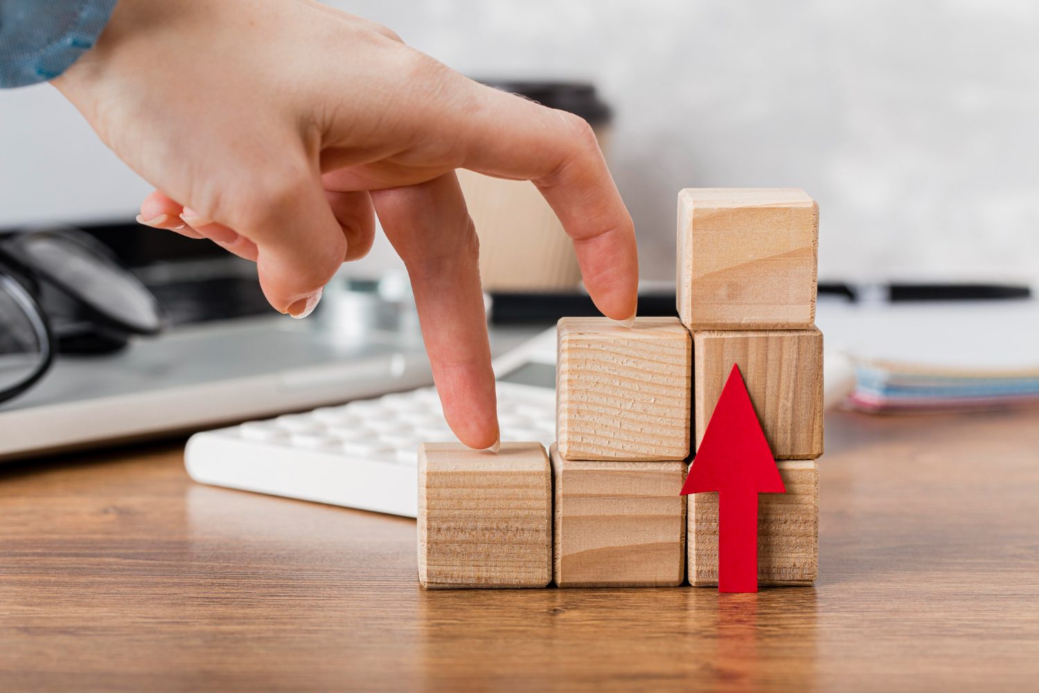 hand-climbing-wooden-blocks-represent-growth hand climbing wooden blocks to represent growth